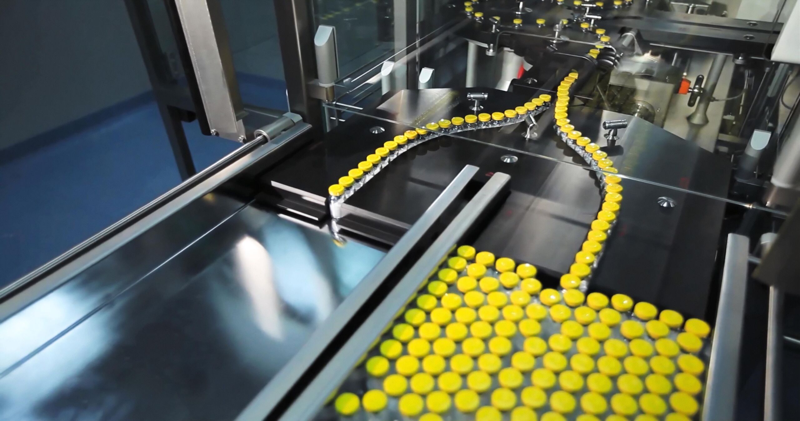 Automated line for marshalling bottles of medicines.